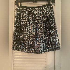 Sequined mini skirt.